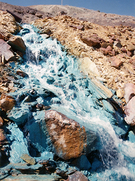 Acid solution over mine tailings